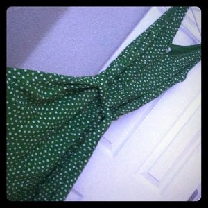 Green polka dot V-neck sleeveless dress.